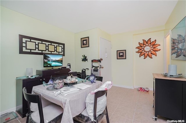 dining area featuring light tile patterned floors