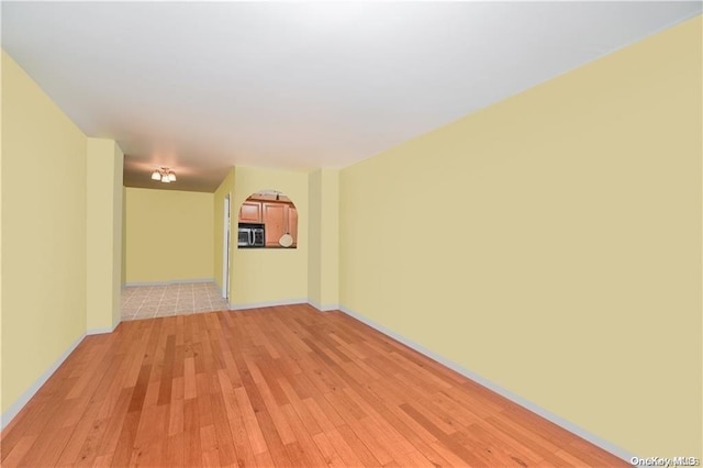 spare room featuring light hardwood / wood-style flooring