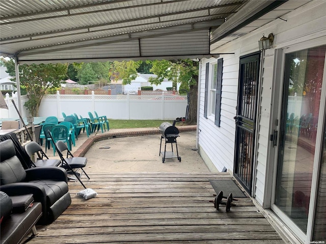 wooden deck with a patio