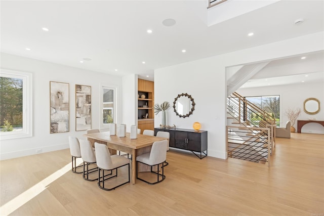 dining space with light hardwood / wood-style flooring