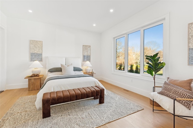 bedroom with hardwood / wood-style flooring