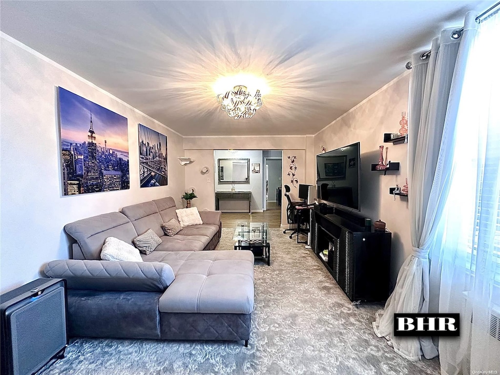 living room with a wealth of natural light and a chandelier