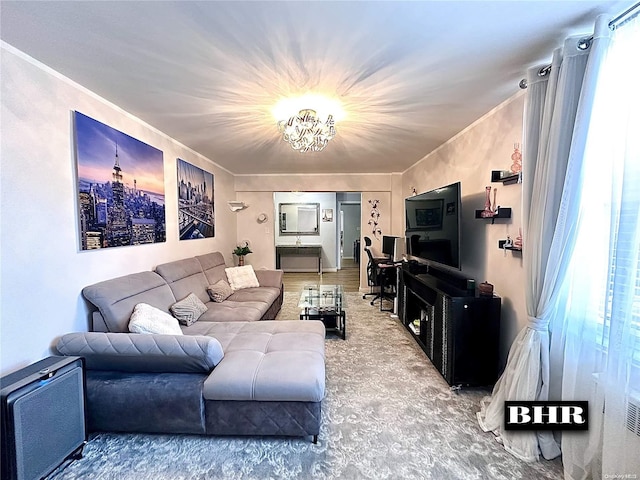 living room with a wealth of natural light and a chandelier