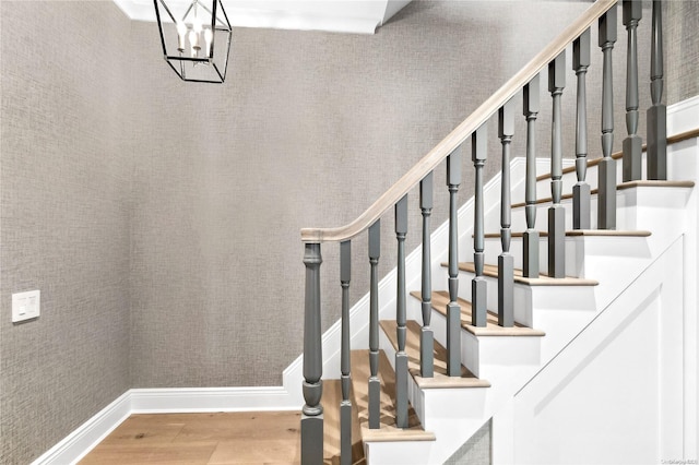 stairway with hardwood / wood-style floors