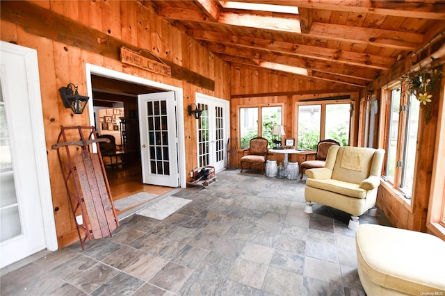 sunroom featuring french doors, vaulted ceiling with beams, and wood ceiling