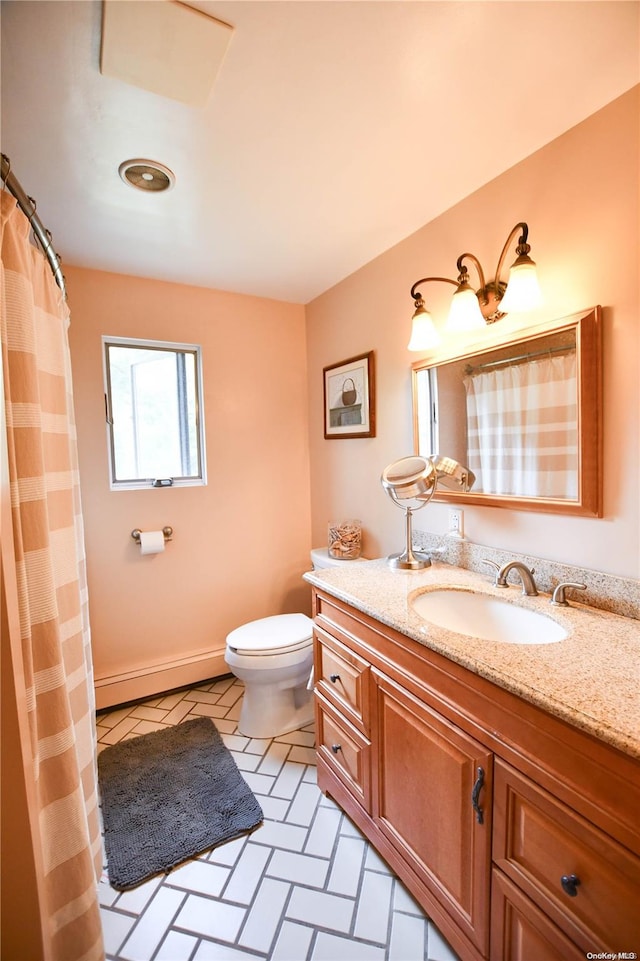 bathroom featuring tile patterned floors, vanity, and toilet