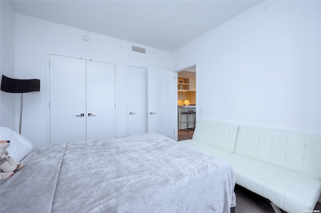 bedroom featuring a closet and hardwood / wood-style floors