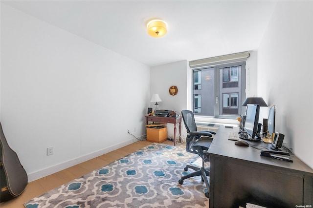 office space with light hardwood / wood-style flooring