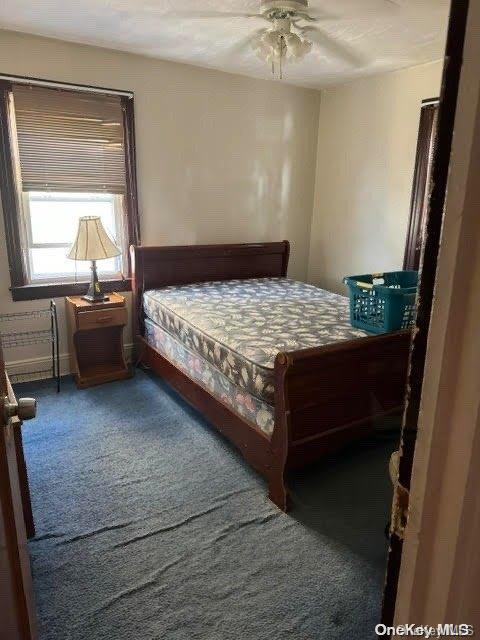 bedroom featuring ceiling fan and carpet floors