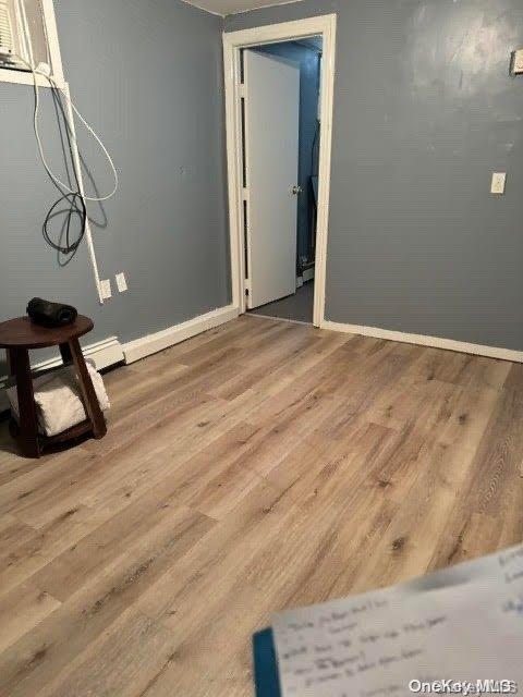 empty room featuring wood-type flooring