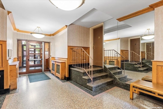 interior space with french doors and crown molding