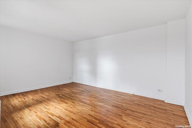 empty room with wood-type flooring