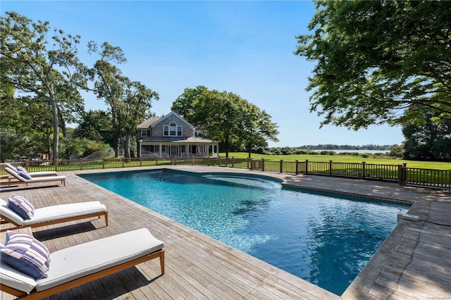 view of swimming pool featuring a deck