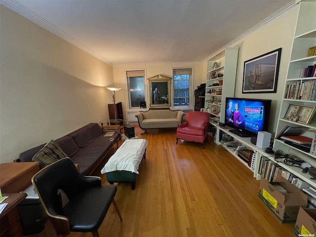 living room with hardwood / wood-style floors and ornamental molding