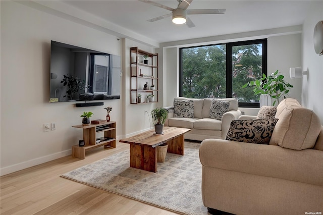 living room with hardwood / wood-style floors and ceiling fan