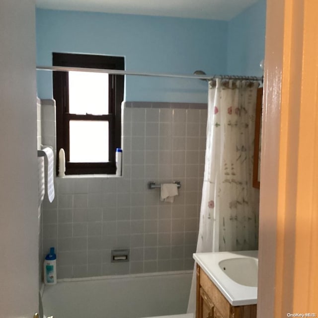 bathroom with vanity and shower / bath combo with shower curtain