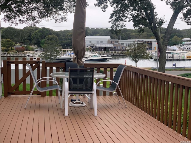 wooden terrace with a water view