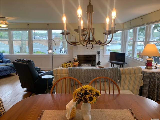 1 Canal Rd, Hampton Bays, NY 11946 - dining area with wood finished floors and a fireplace
