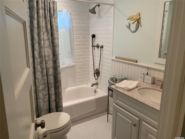 full bathroom with tile patterned floors, vanity, shower / bathtub combination with curtain, and toilet