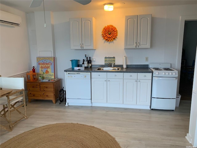 1 Canal Rd, Hampton Bays, NY 11946 - kitchen featuring white appliances, an AC wall unit, a sink, light wood finished floors, and dark countertops
