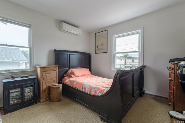 bedroom featuring carpet flooring and a wall unit AC