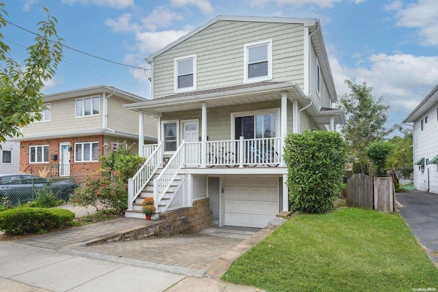 view of front of property with a garage and covered porch