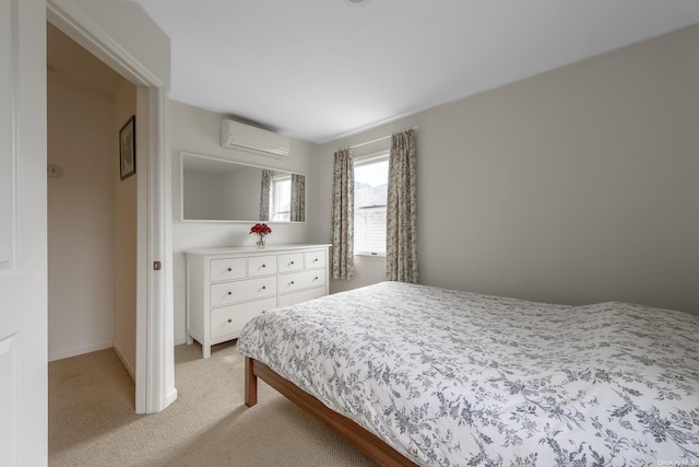 carpeted bedroom featuring a wall mounted AC