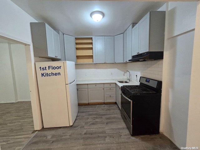 kitchen with white cabinetry, sink, black electric range, white refrigerator, and light hardwood / wood-style floors