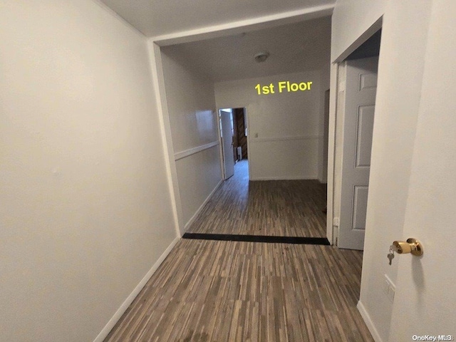 hallway featuring dark wood-type flooring