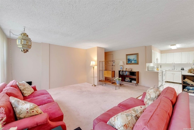 carpeted living room with a textured ceiling