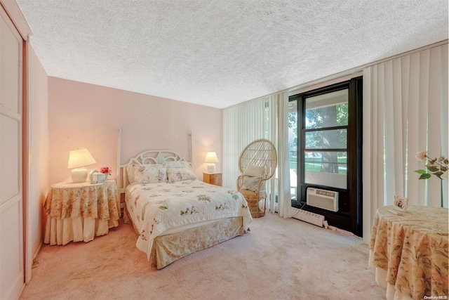 carpeted bedroom with cooling unit and a textured ceiling