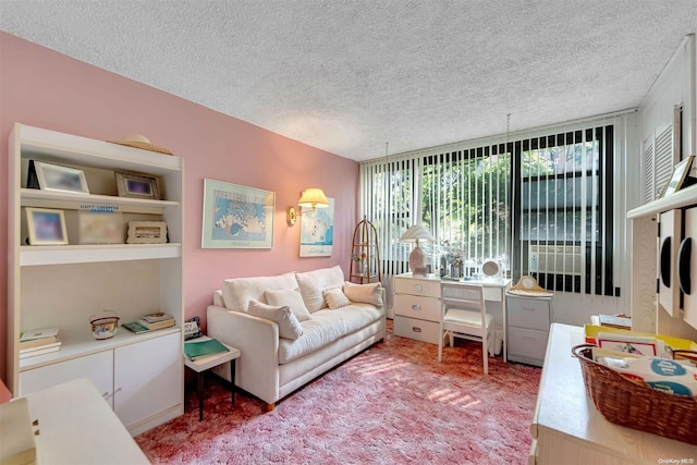 carpeted living room with a textured ceiling