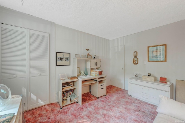 office featuring light carpet and a textured ceiling