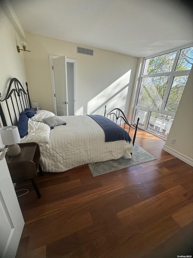 bedroom with wood-type flooring