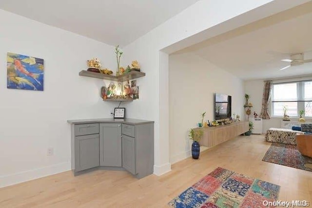 hallway with light hardwood / wood-style floors