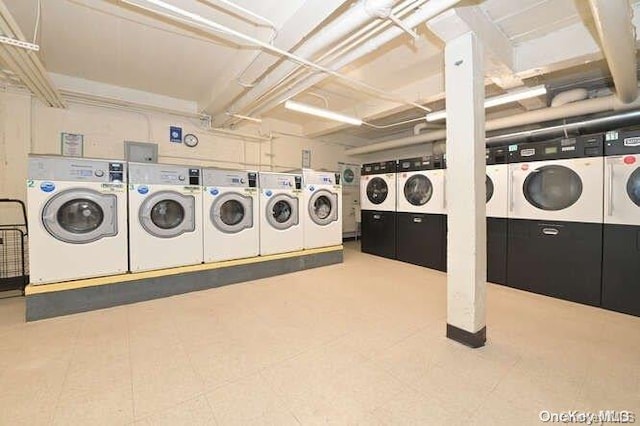 washroom featuring washing machine and dryer