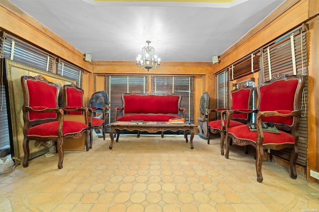 sitting room with a notable chandelier