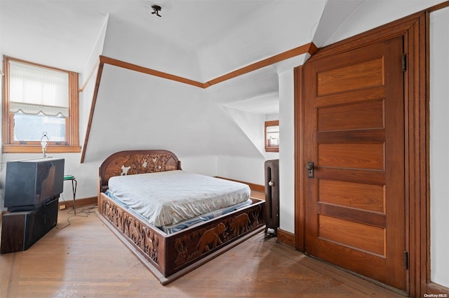 bedroom with hardwood / wood-style flooring