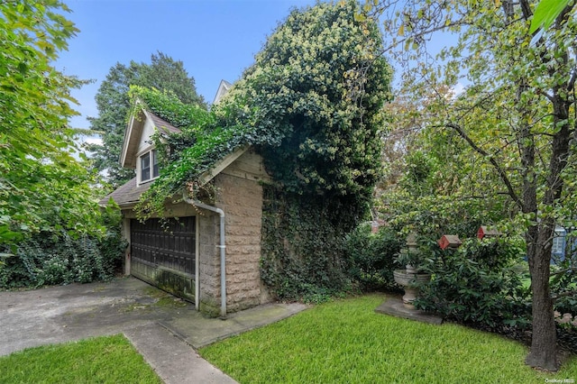 view of property exterior featuring a garage