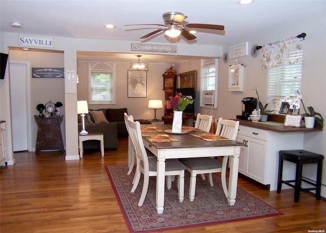 dining room with ceiling fan, dark hardwood / wood-style flooring, cooling unit, and a healthy amount of sunlight