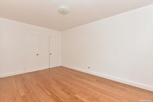 spare room with light wood-type flooring