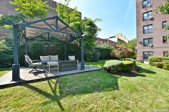 view of yard with an outdoor living space and a patio