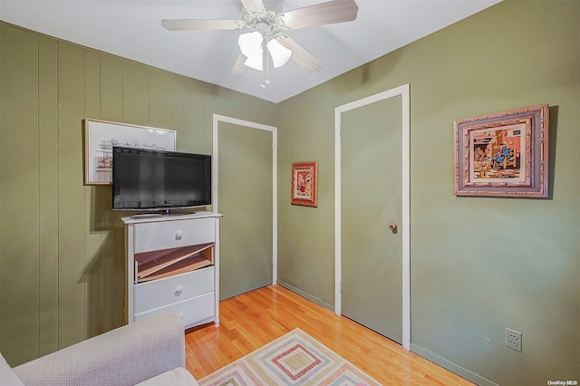 bedroom featuring hardwood / wood-style floors and ceiling fan