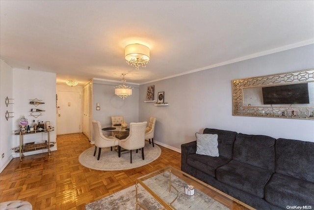 living room featuring parquet flooring, crown molding, and an inviting chandelier