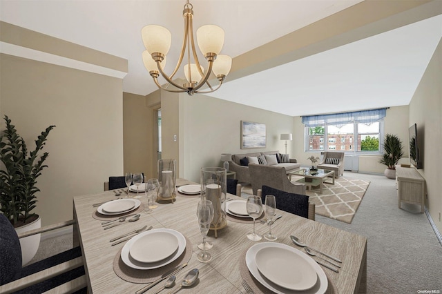 carpeted dining area featuring a notable chandelier