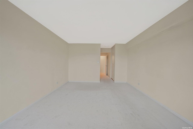 empty room with light colored carpet