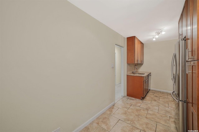 kitchen with stainless steel fridge and sink