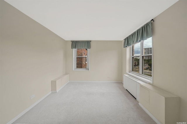 empty room featuring light carpet