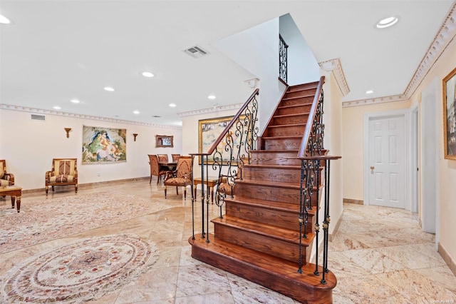 staircase with ornamental molding