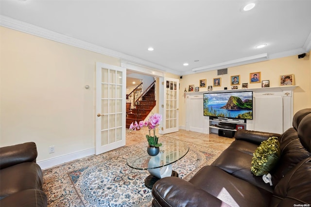 living room with ornamental molding and french doors